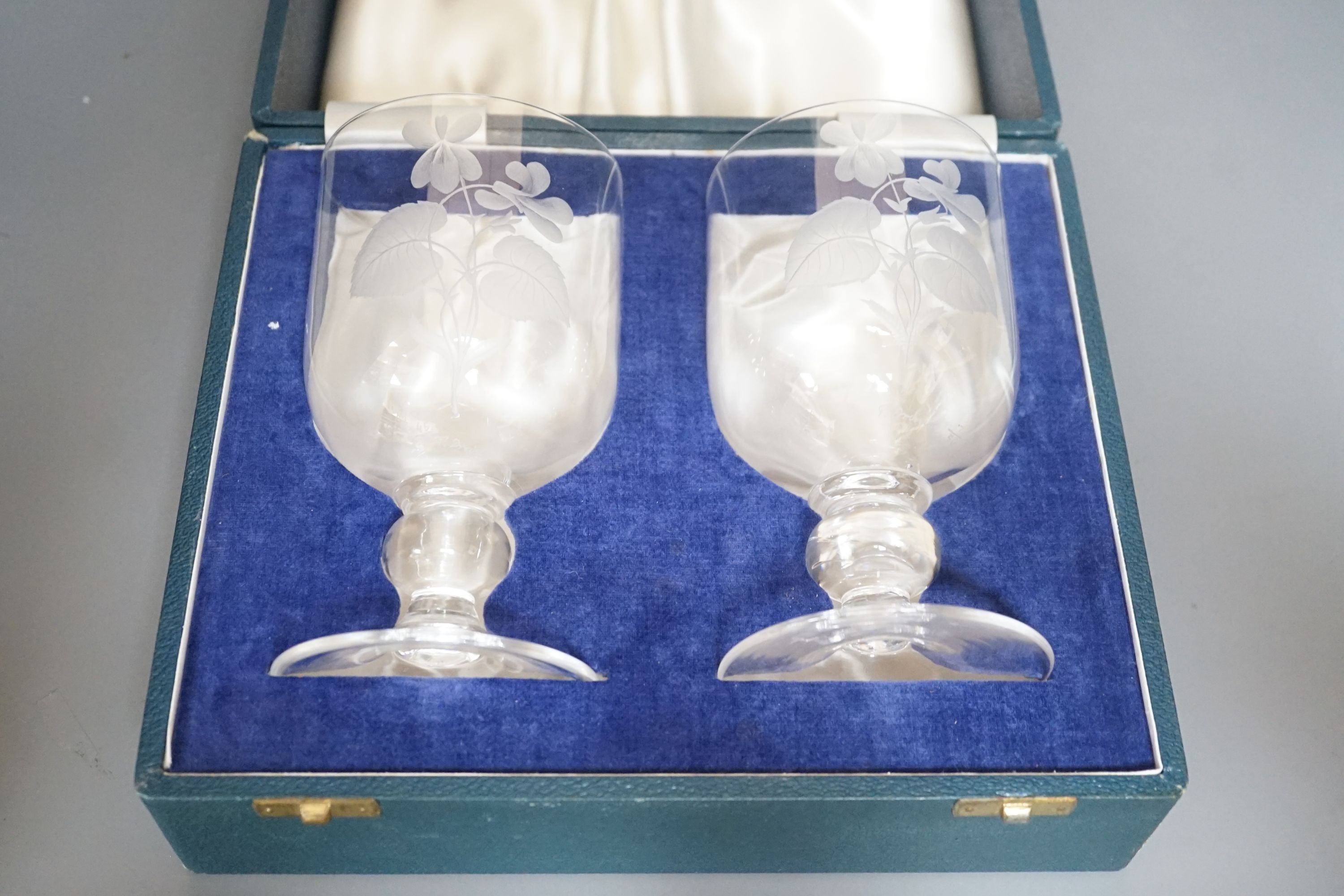 A cased pair of Peter Dreiser wheel etched glasses. Signed and dated 1971. 15cm